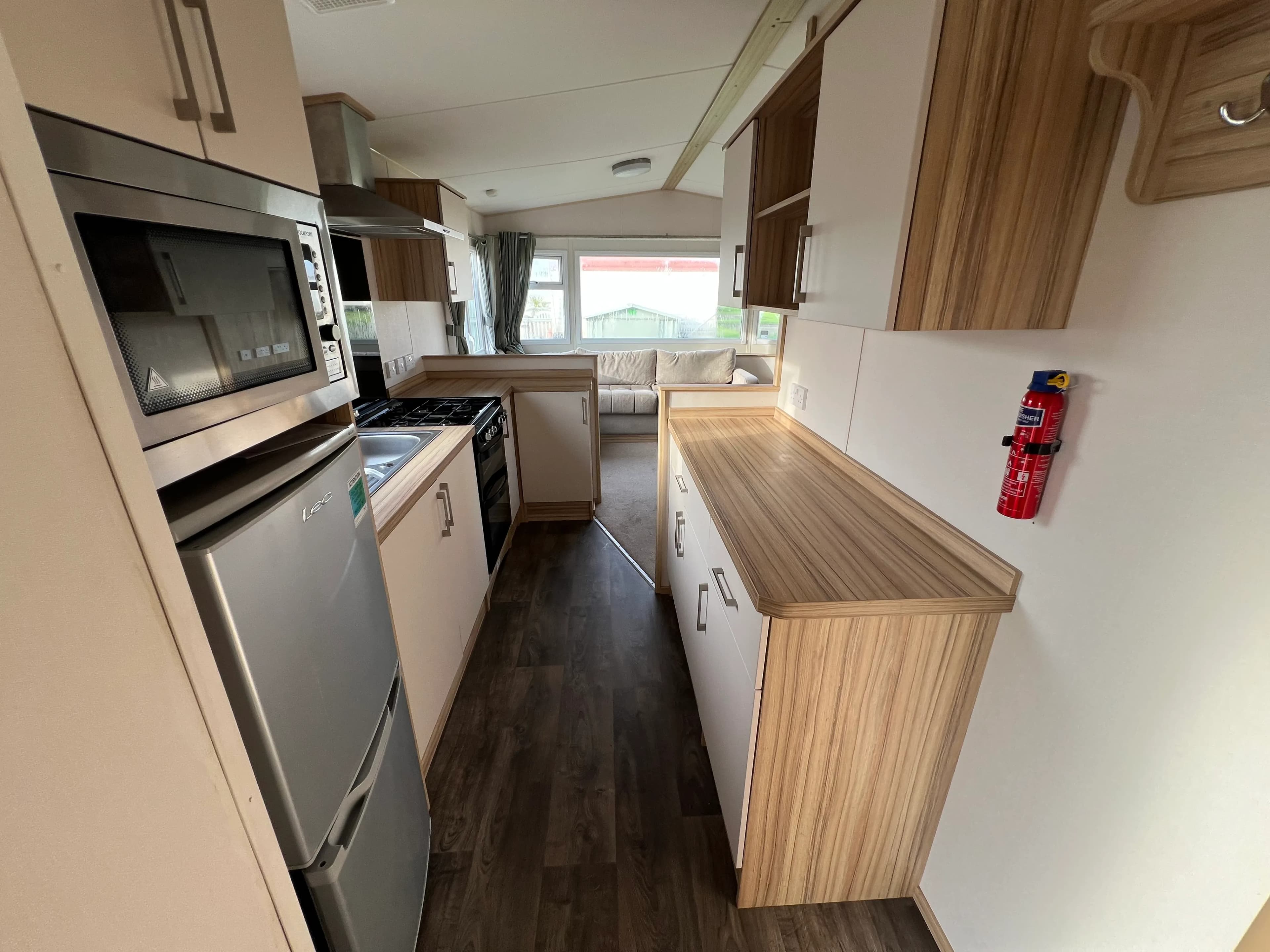 2017 ABI Summerbreeze Deluxe 28x12 2 Bed kitchen 2.jpeg