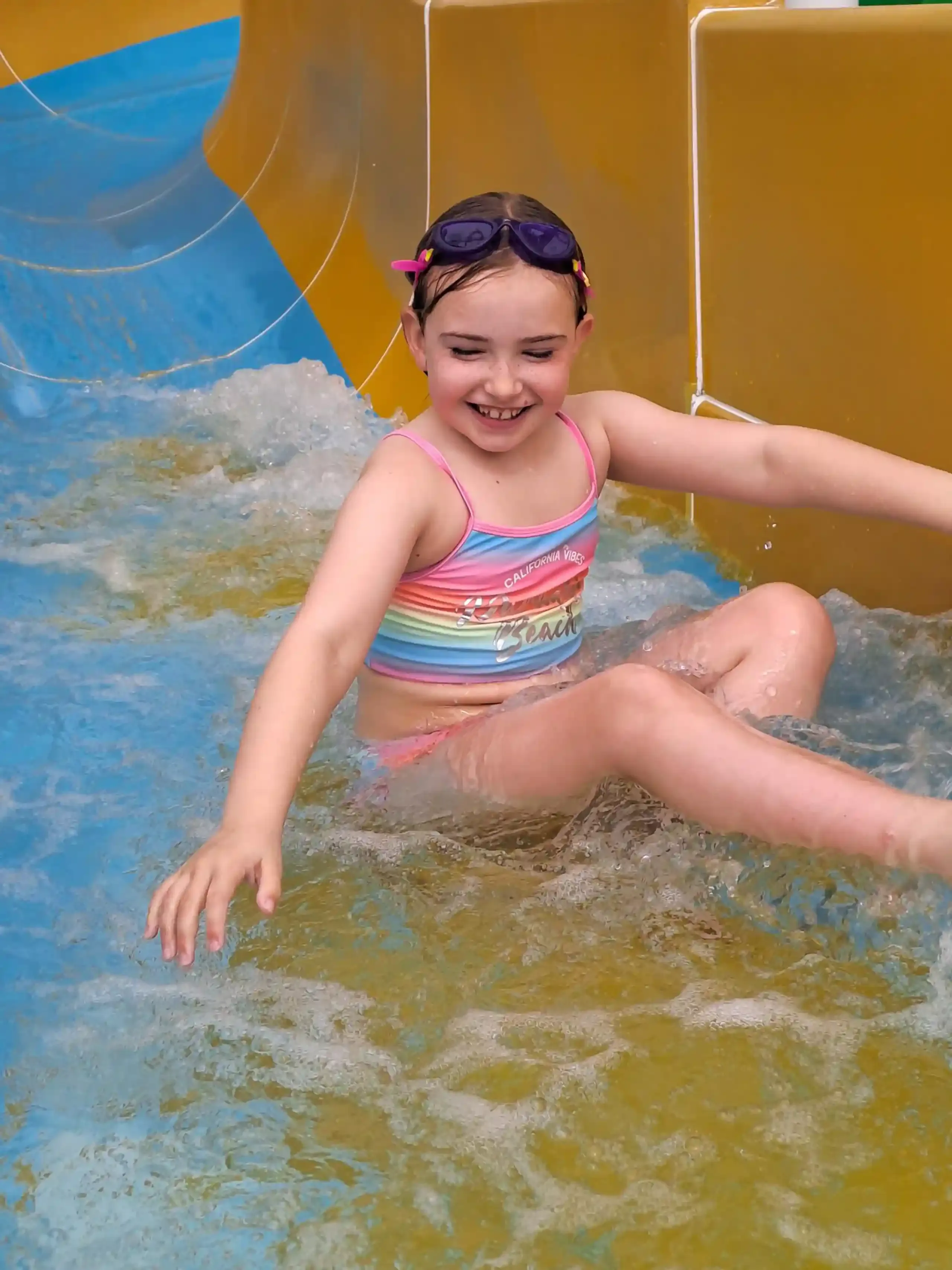 Coastfields Swimming Pool-girl on waterslide