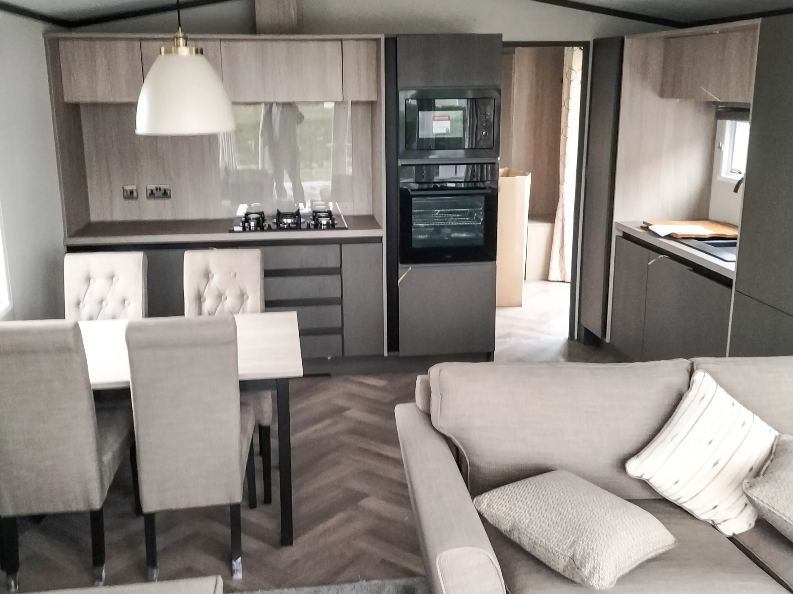 Modern fitted kitchen with integrated appliances in the 2023 Victory Lakewood Lodge