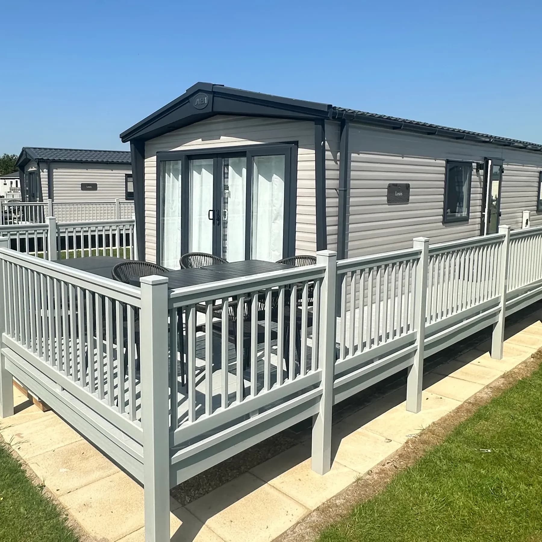 Spacious decking outside the 2026 ABI Louis holiday home at Grange Leisure Park