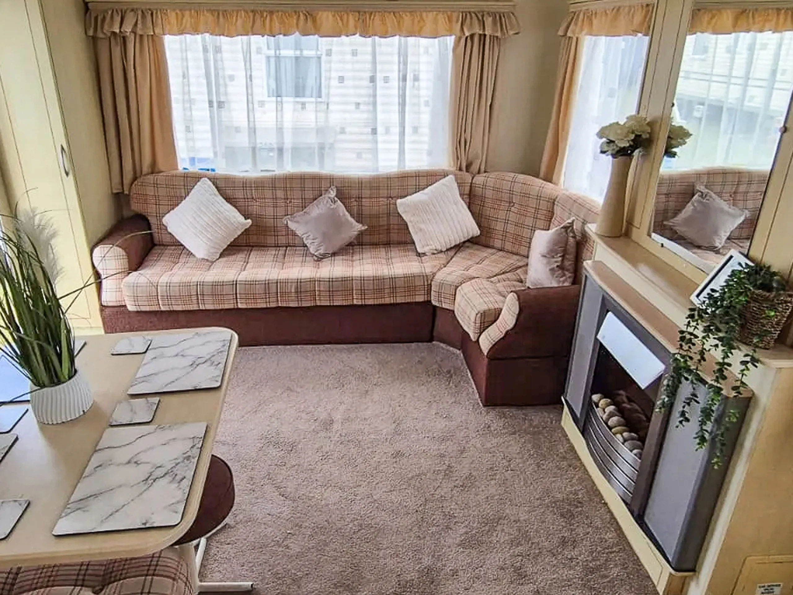 Coastfields 2007 Atlas Oasis lounge with wraparound seating and fireplace